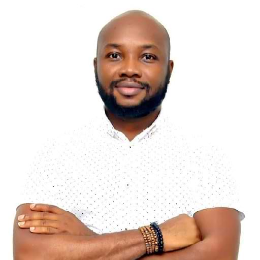 A person with his arms crossed
                Description automatically generated